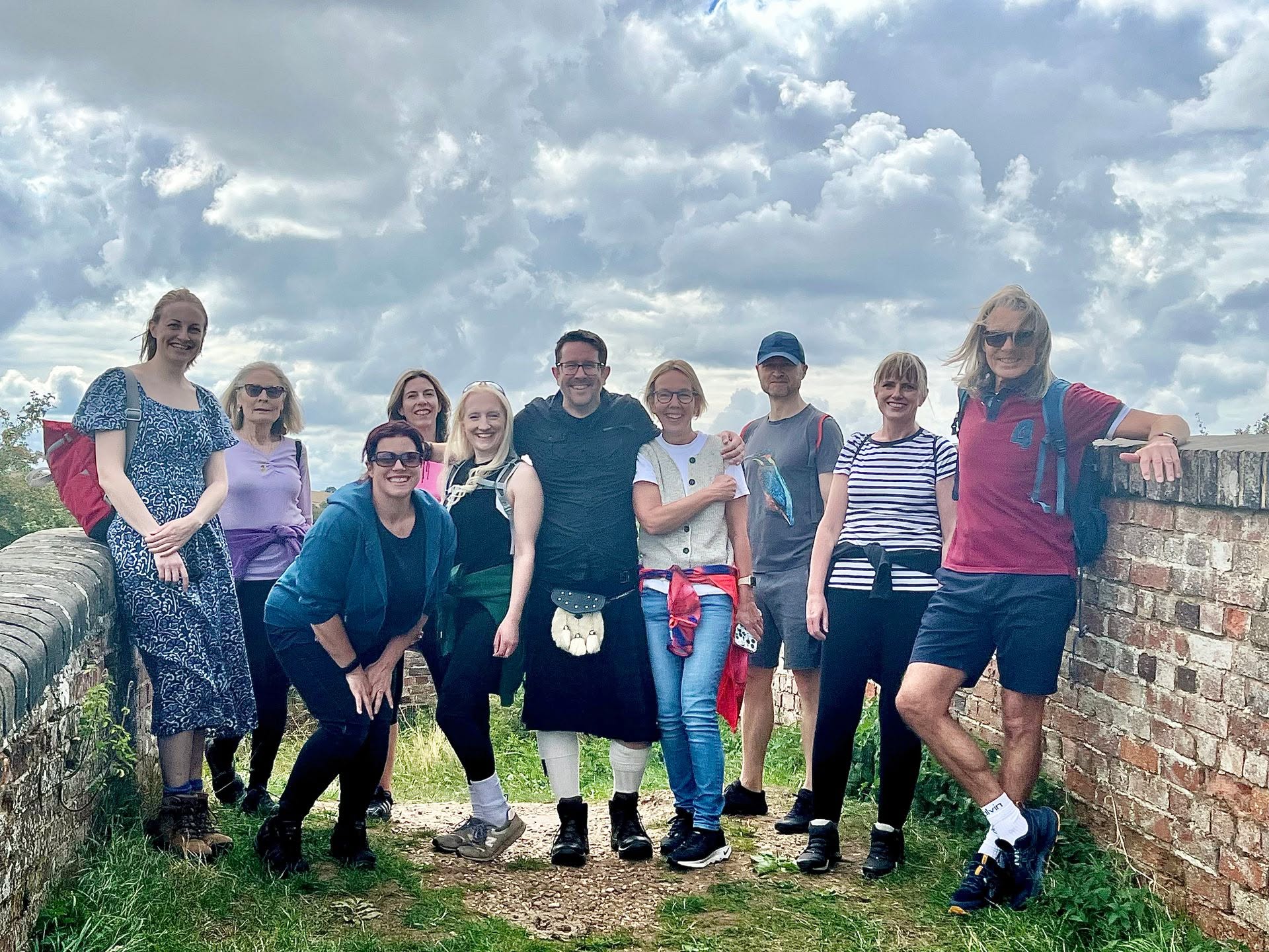 WNP members gathered on a bridge during a club social walk